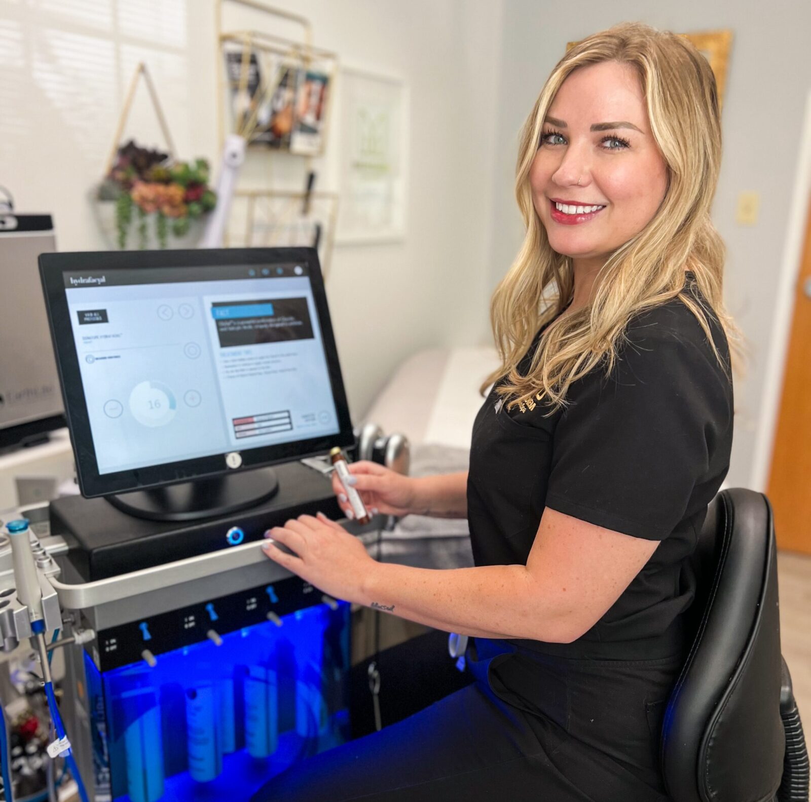 A Meridiem DermSpa provider looking at the computer and providing insight to dermatology care.